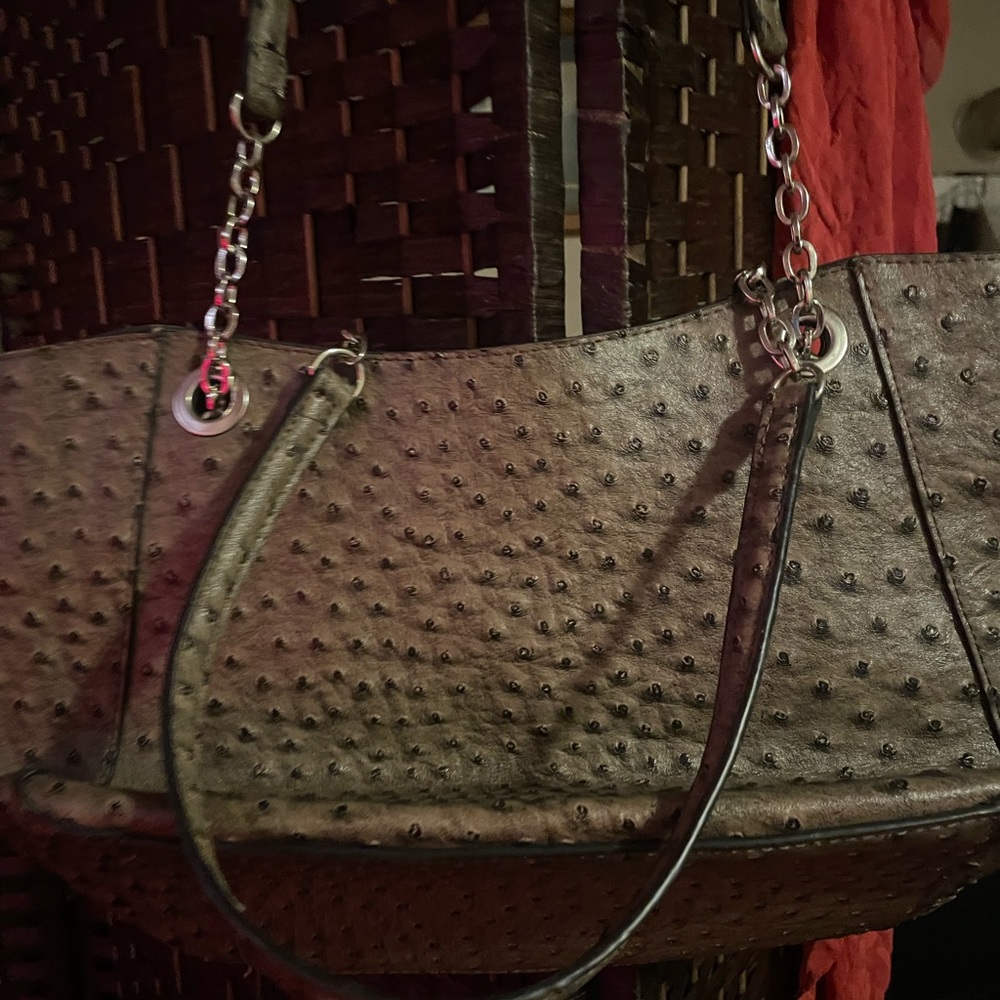 Beautiful medium size bag w/ small tear on inside pocket.